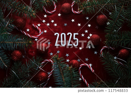 New Year red 2025 background. Number of the coming year in Christmas decoration. 117548833