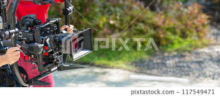 Movie shooting or video production and film crew team with camera equipment Movie shooting or video production and film crew team with camera equipment 117549471