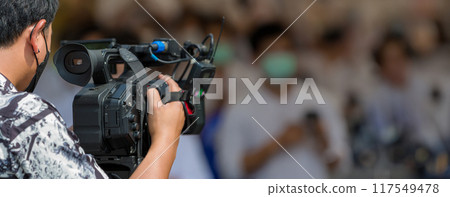 Movie shooting or video production and film crew team with camera equipment 117549478