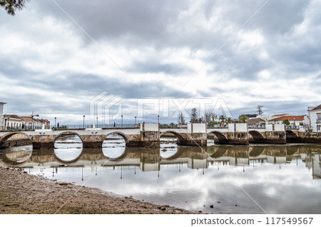 Roman bridge in Tavira, Algarve, Portugal. Ponte Romana bridge in Tavira town 117549567