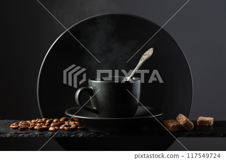 Cup of black coffee with coffee beans and brown sugar. Cup of black coffee with coffee beans and brown sugar. 117549724