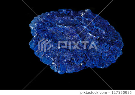 Macro mineral stone Azurite in siltstone against black background 117550955