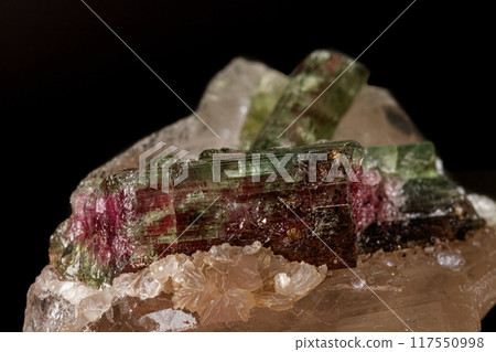 Macro stone tourmaline mineral on a black background Macro stone tourmaline mineral on a black background 117550998