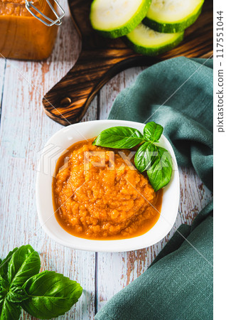 Homemade vegetable vegetarian squash caviar in a bowl on the table vertical view Homemade vegetable vegetarian squash caviar in a bowl on the table vertical view 117551044