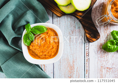 Delicious squash caviar and basil in a bowl on the table top view 117551045