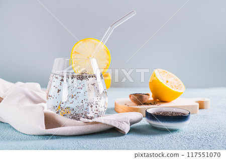 Detox chia water with lemon slice in a glass on the table Detox chia water with lemon slice in a glass on the table 117551070
