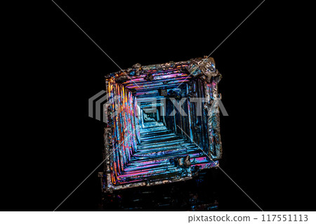Macro of the stone bismuth mineral on a black background 117551113