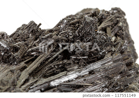 Macro stone black mineral tourmaline Scherl on white background Macro stone black mineral tourmaline Scherl on white background 117551149