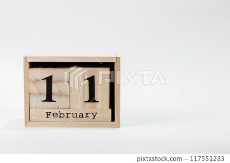 Wooden calendar February 11 on a white background Wooden calendar February 11 on a white background 117551283