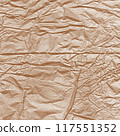 Kraft paper texture.Craft wrapping paper. The texture of a flat crumpled sheet of cellulose products. Old tattered page surface background. Eco-friendly empty aged recyclable packaging. 117551352