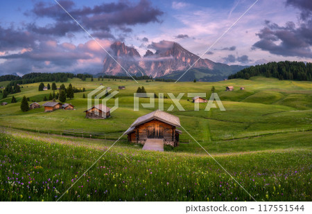 Colorful landscape with alpine mountains in low clouds and houses Colorful landscape with alpine mountains in low clouds and houses 117551544