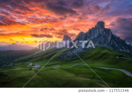 Road in mountains, golden sunlight and colorful sky at sunset Road in mountains, golden sunlight and colorful sky at sunset 117551546