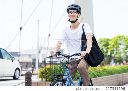 A man riding a bicycle 117551596