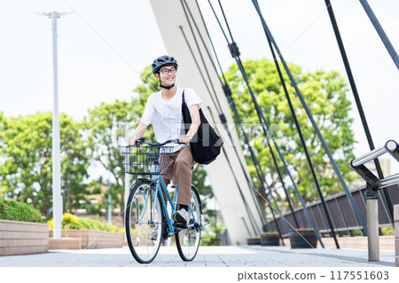 A man riding a bicycle A man riding a bicycle 117551603