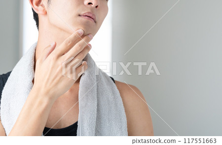Young man suffering from skin problems Young man suffering from skin problems 117551663