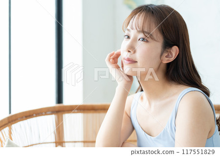 Beauty image of a young woman doing skin care Beauty image of a young woman doing skin care 117551829