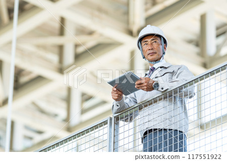 Senior man in work clothes Senior man in work clothes 117551922