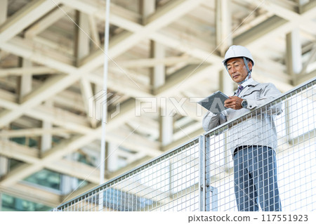 Senior man in work clothes Senior man in work clothes 117551923