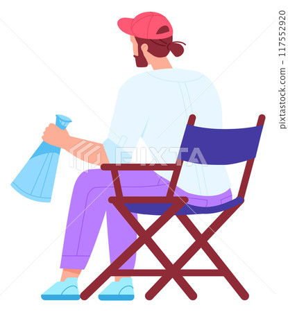 Film director character. Man sit on chair with loud speaker 117552920