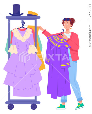 Cinema costume crew worker choose dresses for scene shooting 117552975