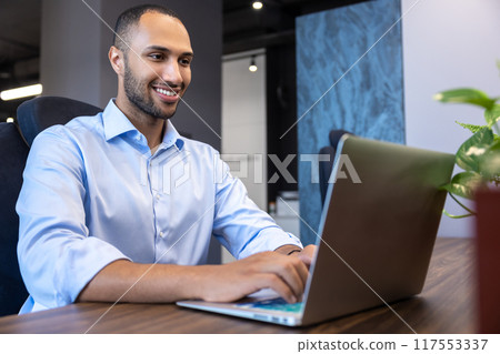African American man digital entrepreneur working on e-commerce startup project on laptop African American man digital entrepreneur working on e-commerce startup project on laptop 117553337