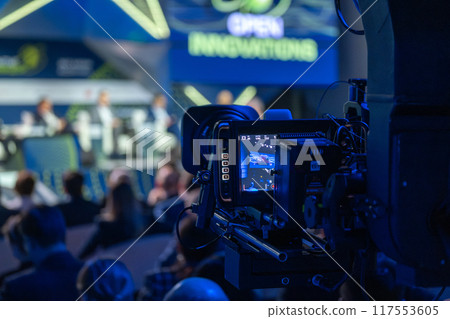Filming a live panel discussion at a conference 117553605