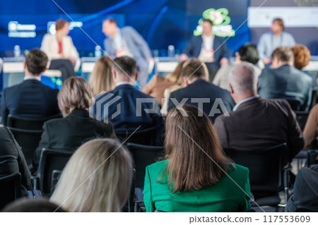 Audience attentively listening to business conference panel discussion Audience attentively listening to business conference panel discussion 117553609