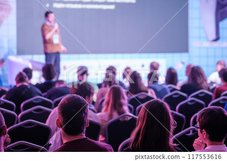 Audience listens to speaker at professional conference or seminar event 117553616