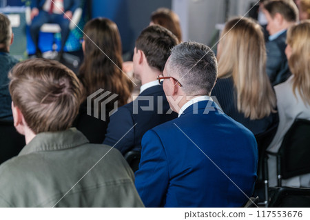 Business professionals attending a seminar or conference Business professionals attending a seminar or conference 117553676