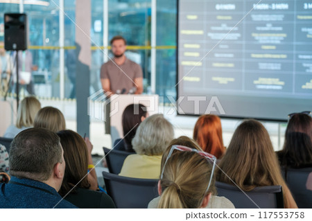 Business presentation with audience in modern conference room 117553758