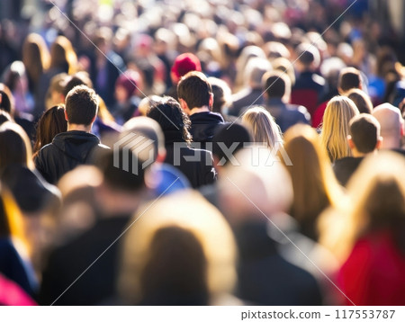 Large crowd of people walking in busy urban street Large crowd of people walking in busy urban street 117553787