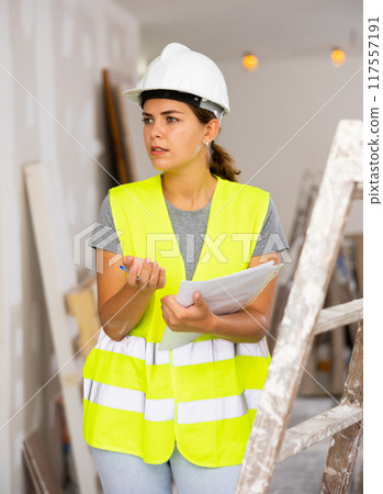 Woman foreman expresses dissatisfaction with repair work performed Woman foreman expresses dissatisfaction with repair work performed 117557191