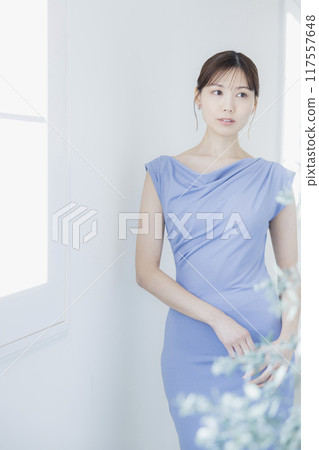 Woman in light blue dress Woman in light blue dress 117557648