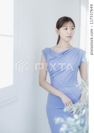 Woman in light blue dress 117557649