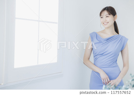 Woman in light blue dress Woman in light blue dress 117557652
