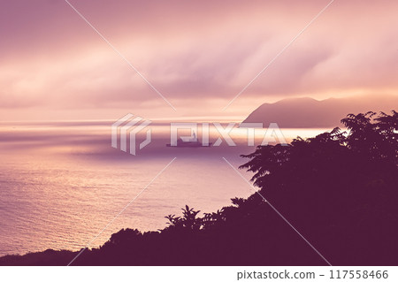 A ship resembling a destroyer floating in the Goto Nada Sea at dawn 117558466