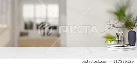 A copy space for displaying products on a white marble tabletop in a modern white room. 117559129