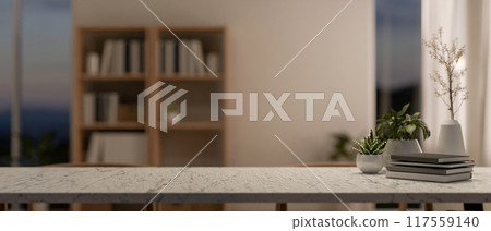 A textured stone tabletop featuring a copy space for displaying products in a contemporary room. A textured stone tabletop featuring a copy space for displaying products in a contemporary room. 117559140