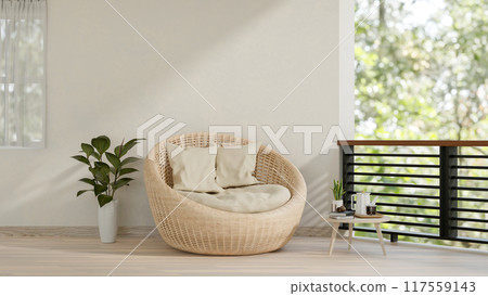 A contemporary home balcony relaxation space features a wicker lounge chair with pillows. 117559143
