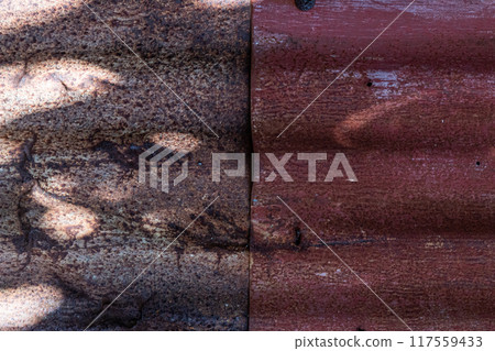 The texture of a rusty zinc wall weathered by the weather The texture of a rusty zinc wall weathered by the weather 117559433