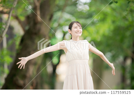 A woman bathing in the forest in the park A woman bathing in the forest in the park 117559525
