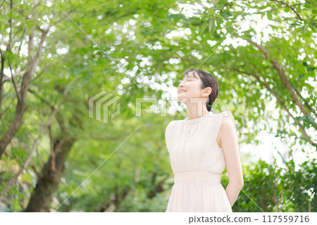 A woman bathing in the forest in the park 117559716
