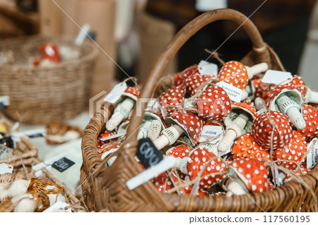 Sale of handmade ceramic Christmas tree toys at the Christmas Fair. Black Friday for the winter holidays. Sale of handmade ceramic Christmas tree toys at the Christmas Fair. Black Friday for the winter holidays. 117560195
