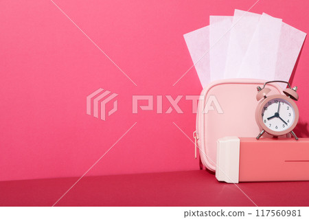 Wax strips for depilation with a pink cosmetic bag 117560981