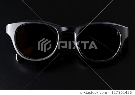 Sunglasses photographed against a black background Sunglasses photographed against a black background 117561436