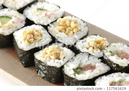 Assorted sushi rolls photographed on a white background 117561629