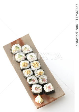 Assorted sushi rolls photographed on a white background Assorted sushi rolls photographed on a white background 117561643