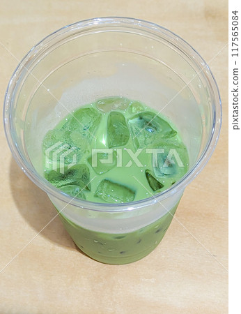 Half-drunk matcha latte 117565084