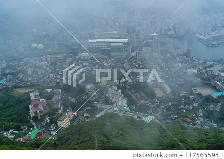 Nagasaki cityscape shrouded in mist and clouds from the Inasayama Observatory [Nagasaki City] 117565593