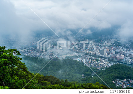 Nagasaki cityscape shrouded in mist and clouds from the Inasayama Observatory [Nagasaki City] 117565618